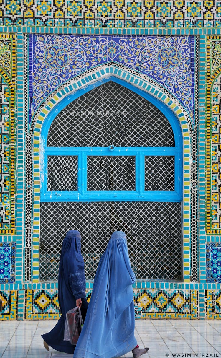 Two Women In Burqa Walking Past Hazrat Ali Mazar Mosque In Mazar-i-Sharif, Afghanistan