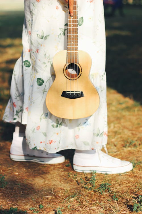 Ukulele Carried by the Fretboard