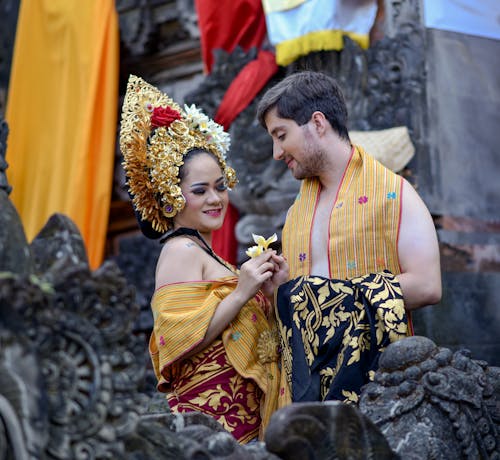 Couple in Traditional Balinese Wedding Clothes on the Temple Terrace