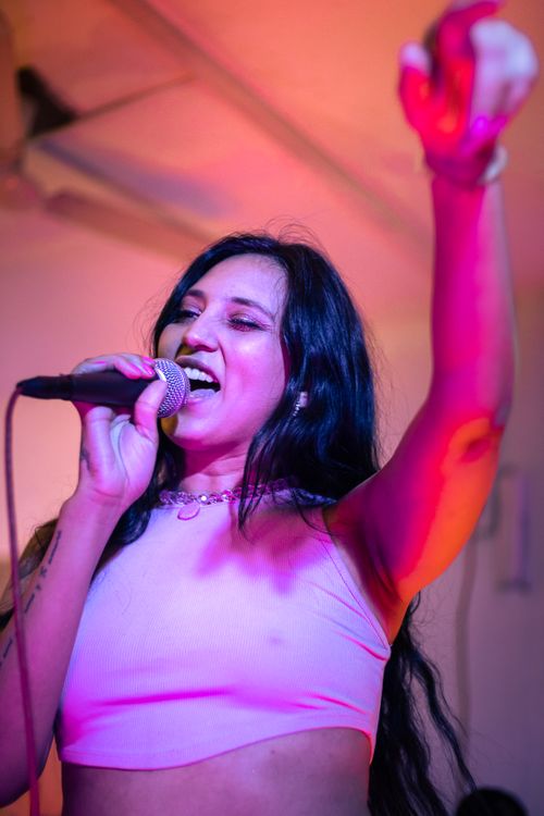 Brunette Singer in Crop Top during Concert in · Free Stock Photo