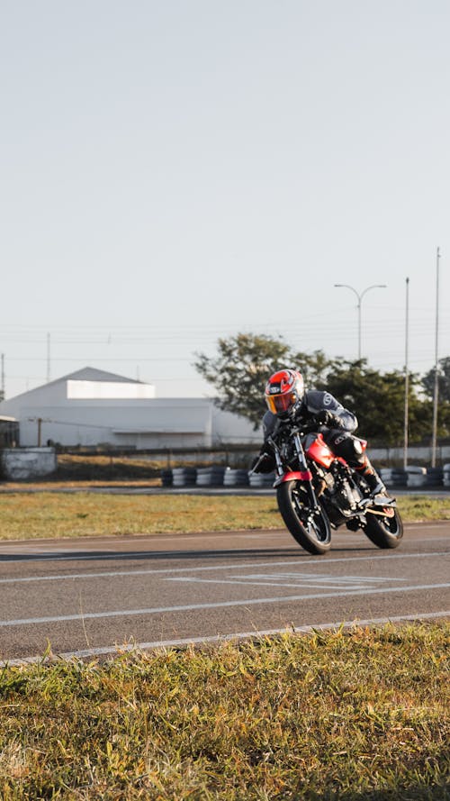 Biker Riding Motorcycle on Race Track