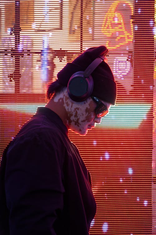 DJ with Headphones in Nightclub