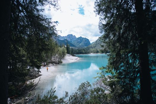 Discover the tranquil beauty of Lake Prags surrounded by the Dolomites in South Tyrol, Italy.