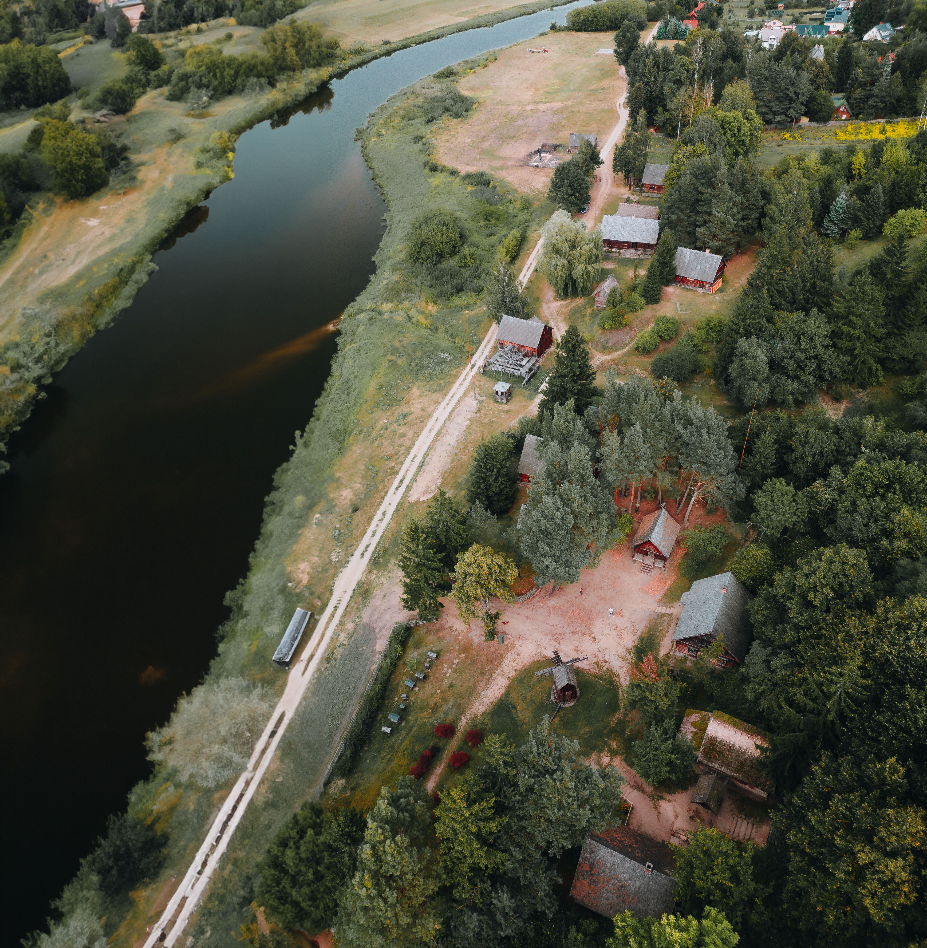 Aerial View of Houses by the River in the Countryside · Free Stock Photo