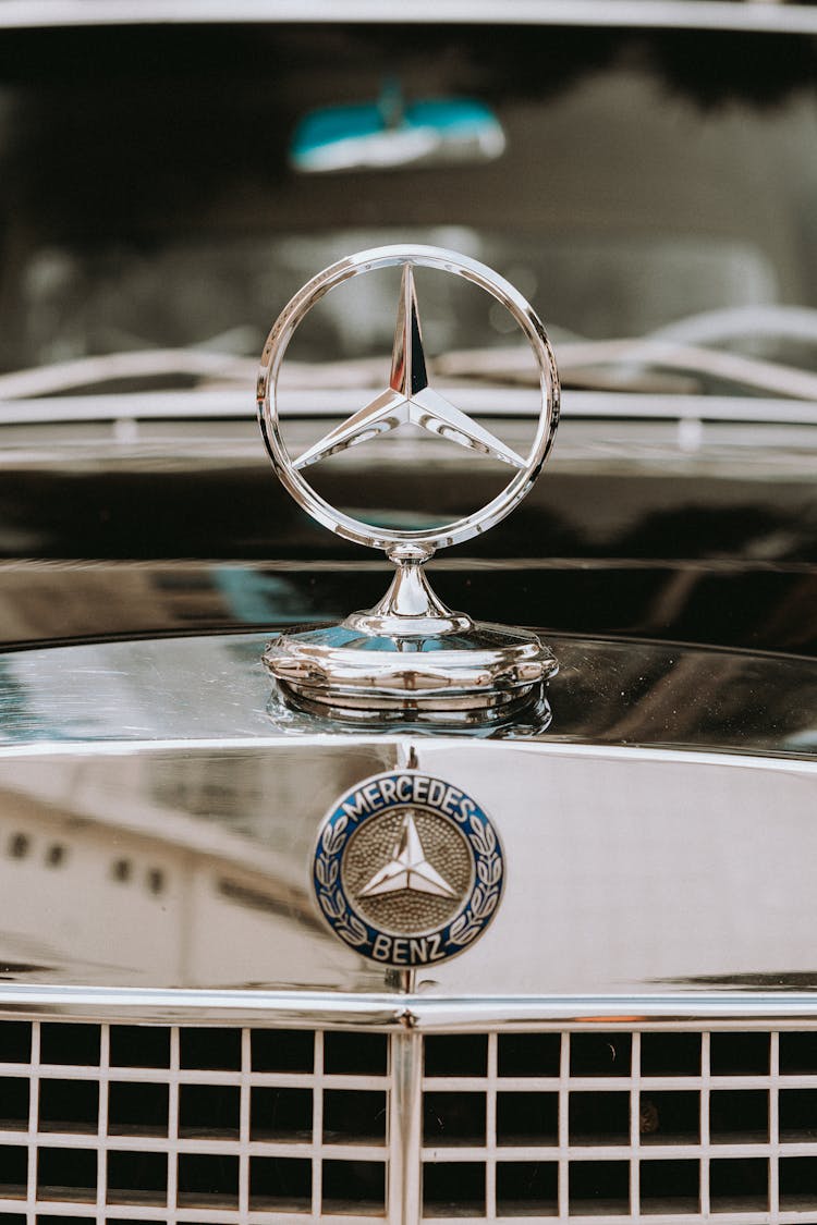 Close-up Of The Logo Of A Vintage Mercedes Car 