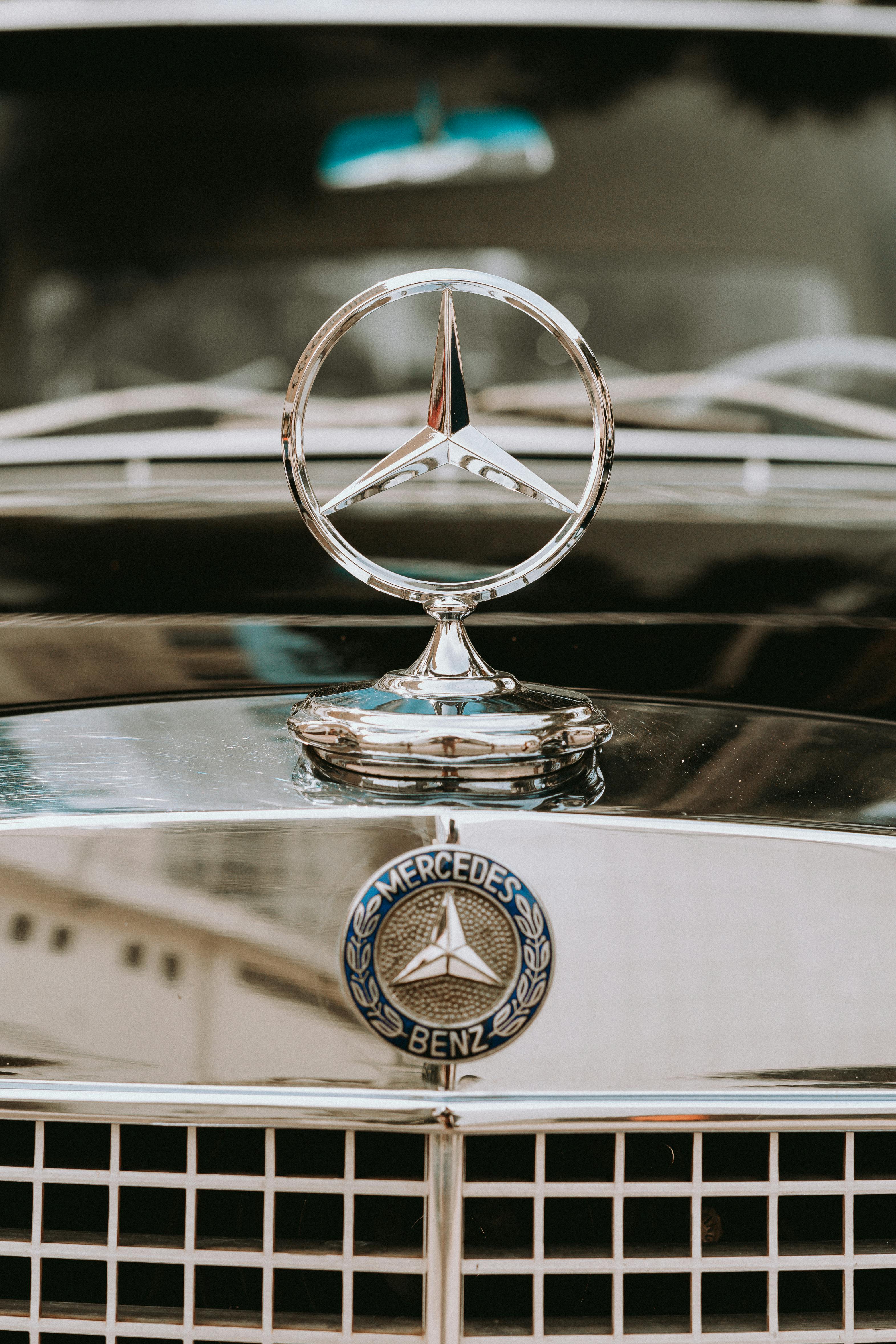 Close-up of the Logo of a Vintage Mercedes Car · Free Stock Photo