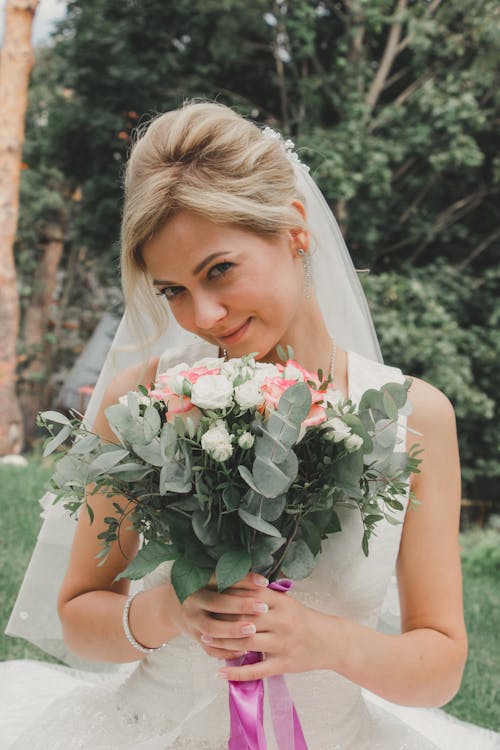 Smiling Bride with Flowers Bouquet