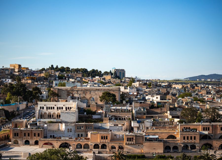 Aerial view of historic Sanliurfa showcasing traditional architecture and vibrant landscapes.