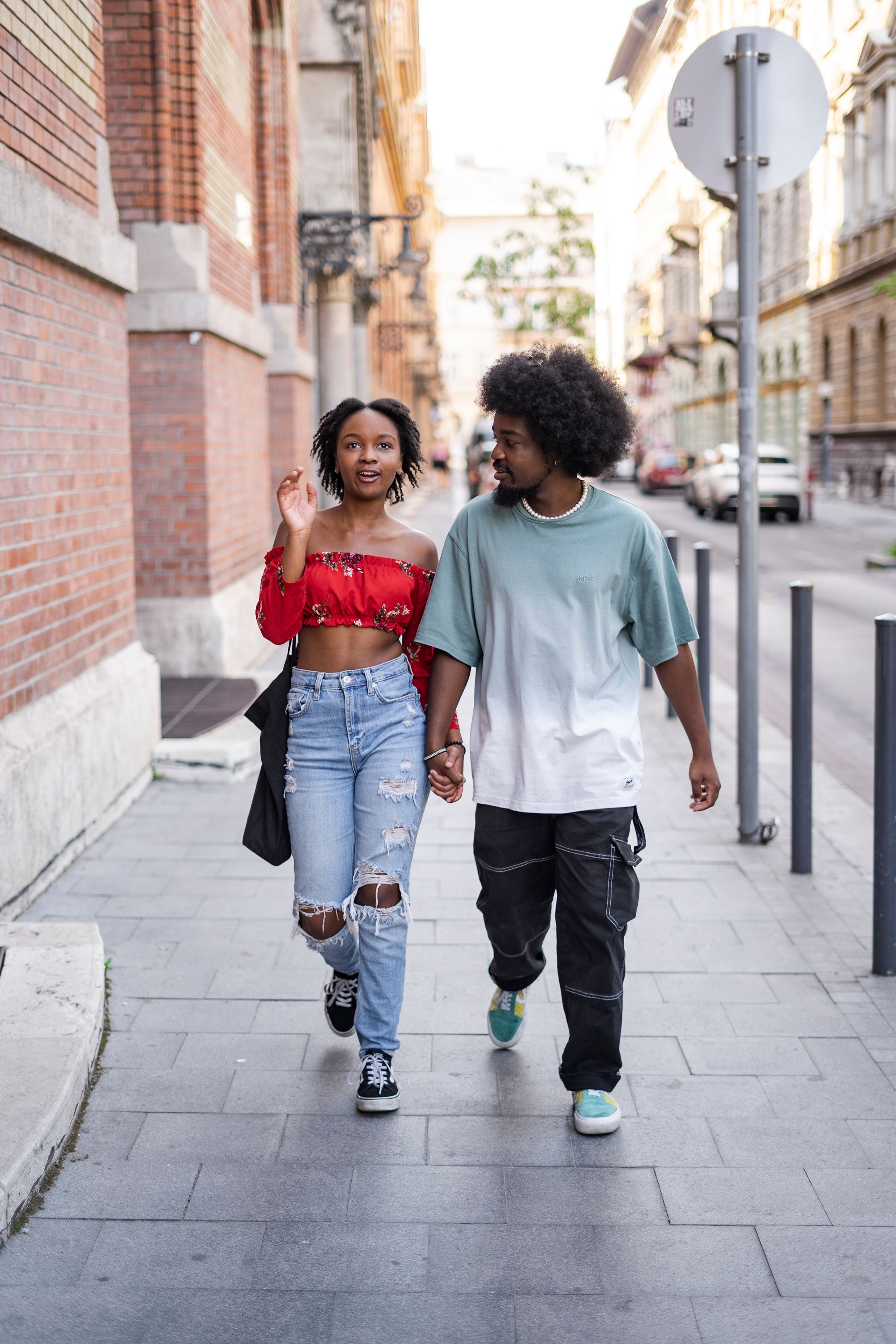 Couple Walking on a Pavement · Free Stock Photo