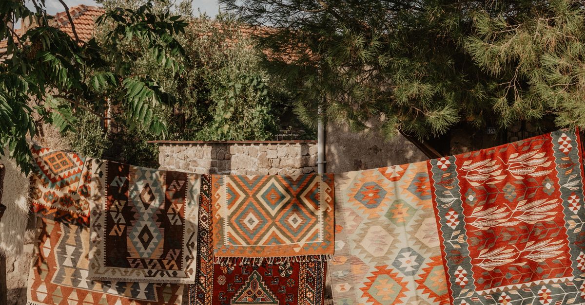 Filded Hanging Rug Traditional Rugs with Patterns Hanging Outside · Free Stock Photo