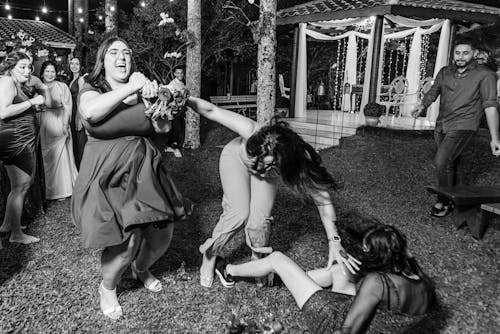 Young Women Having Fun at an Outdoor Party 
