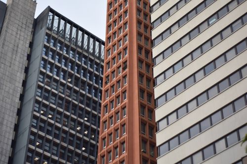Free Close-up of modern skyscrapers with diverse architectural styles and glass facades. Stock Photo