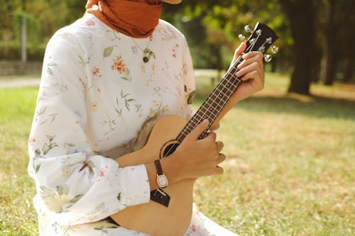 Close up of Woman Playing Guitar