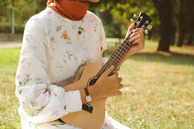 Close Up Of Woman Playing Guitar