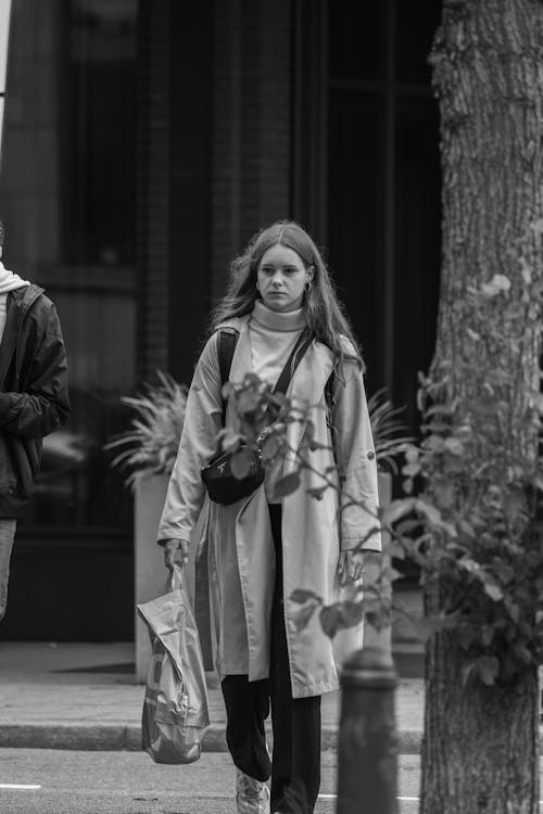 Pedestrian with Shopping Back in City