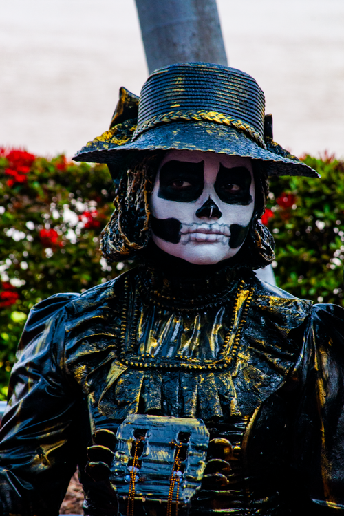 Free Person wearing detailed Day of the Dead costume with painted face, captured outdoors in Guayaquil, Ecuador. Stock Photo