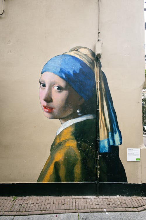 Girl with a Pearl Earring Mural on Wall in City