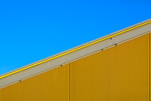 Corrugated Metal on Facade of Yellow Building