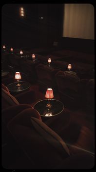 Cozy cinema ambiance in Istanbul, featuring plush armchairs and dim lamps.