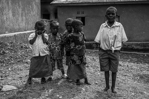 Free Black and white photo of African children posing in their rural village. Stock Photo