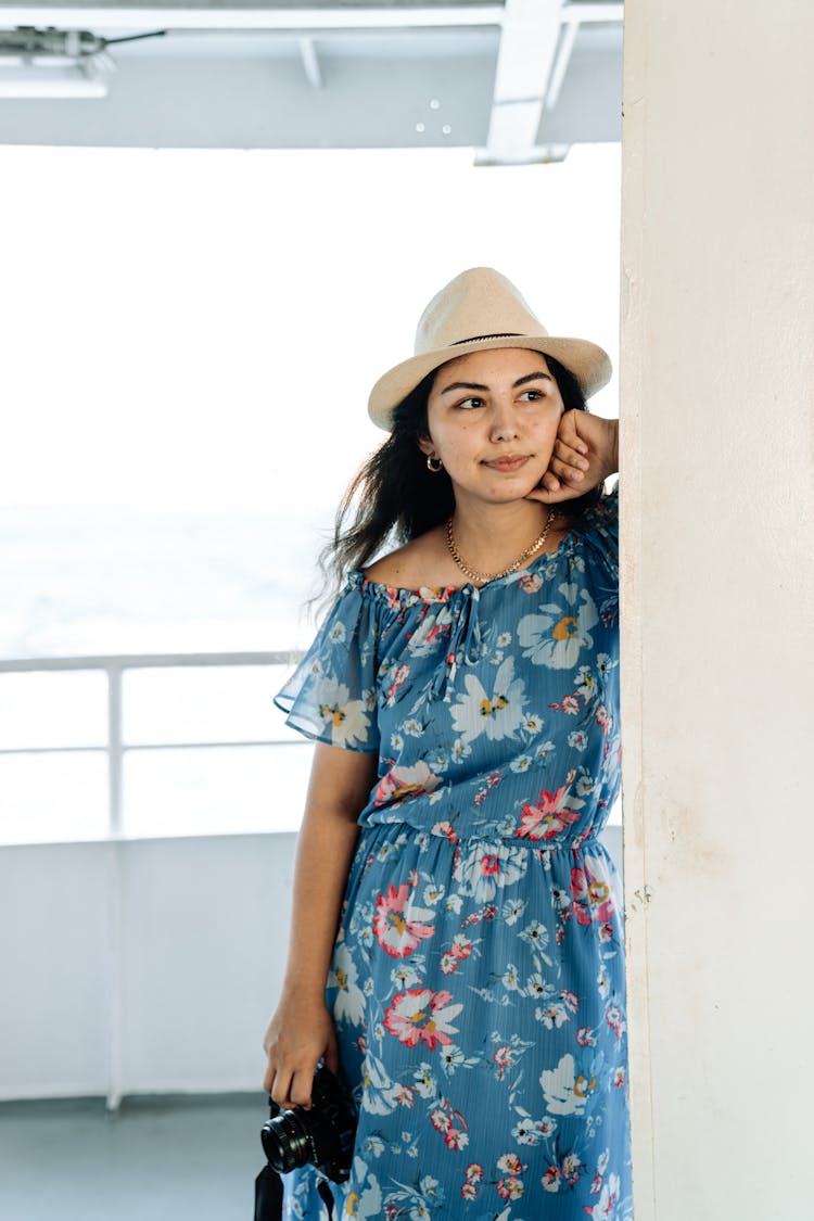 Woman In A Dress And Hat On A Ferry 