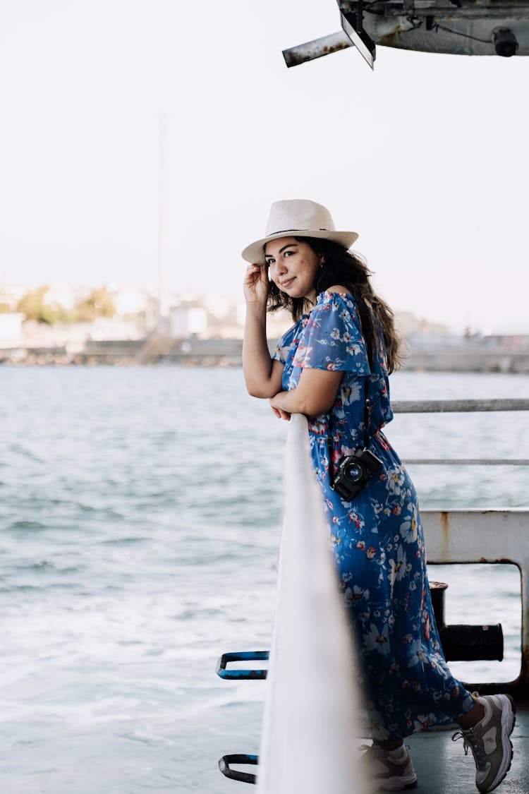 Woman In A Dress And Hat On A Ferry 