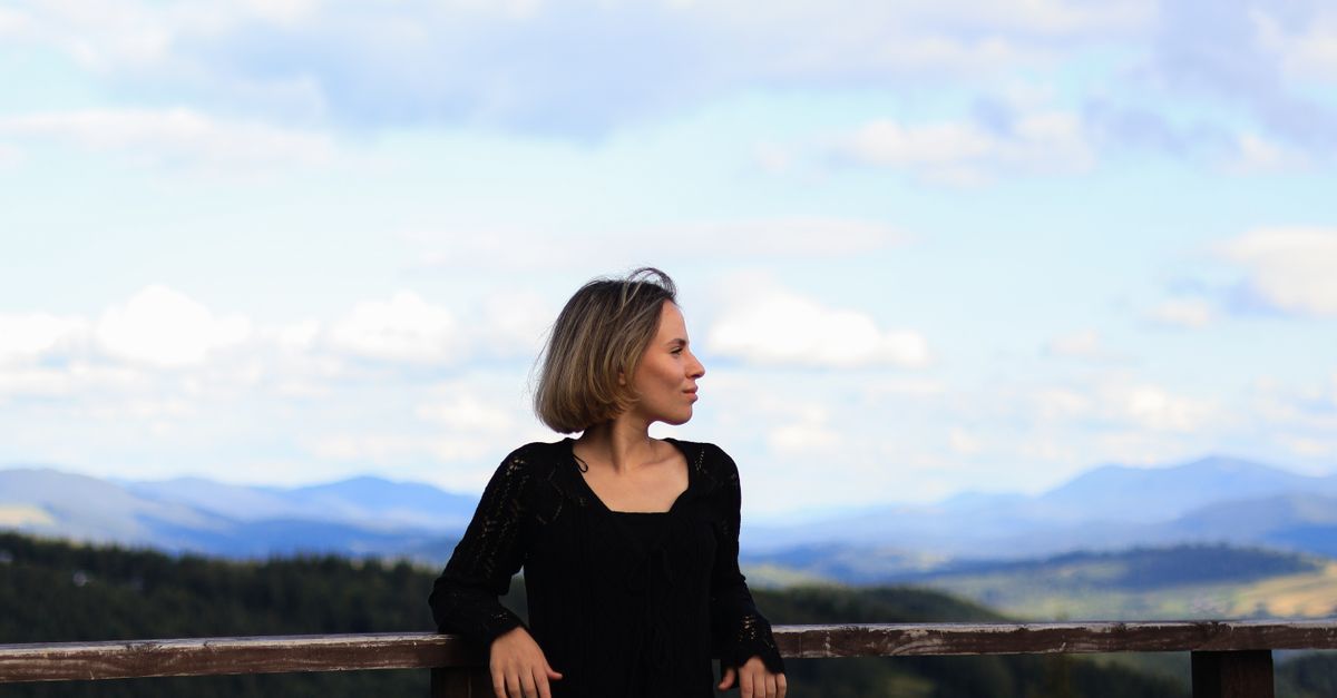 Leaning Back Against Railing Woman in Black Leaning against Railing · Free Stock Photo