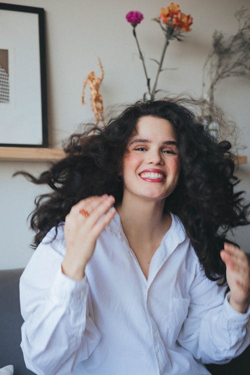 Smiling Woman in White Shirt