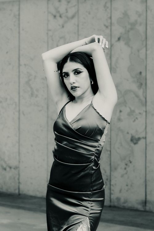 Free Stunning black and white portrait of a woman in a satin dress, showcasing elegance and style. Stock Photo