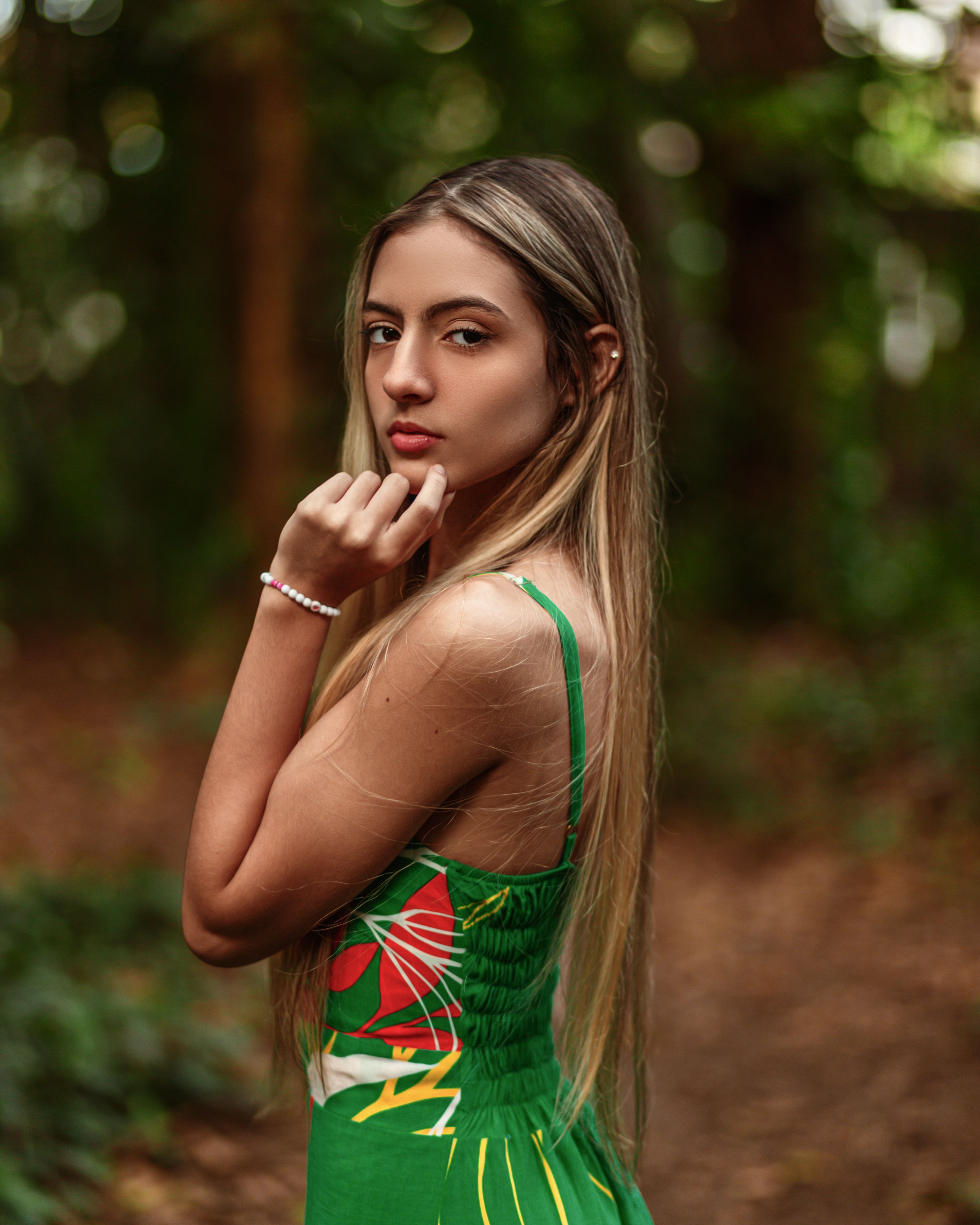 Woman Wearing Green Dress Posing in Forest  Free Stock Photo