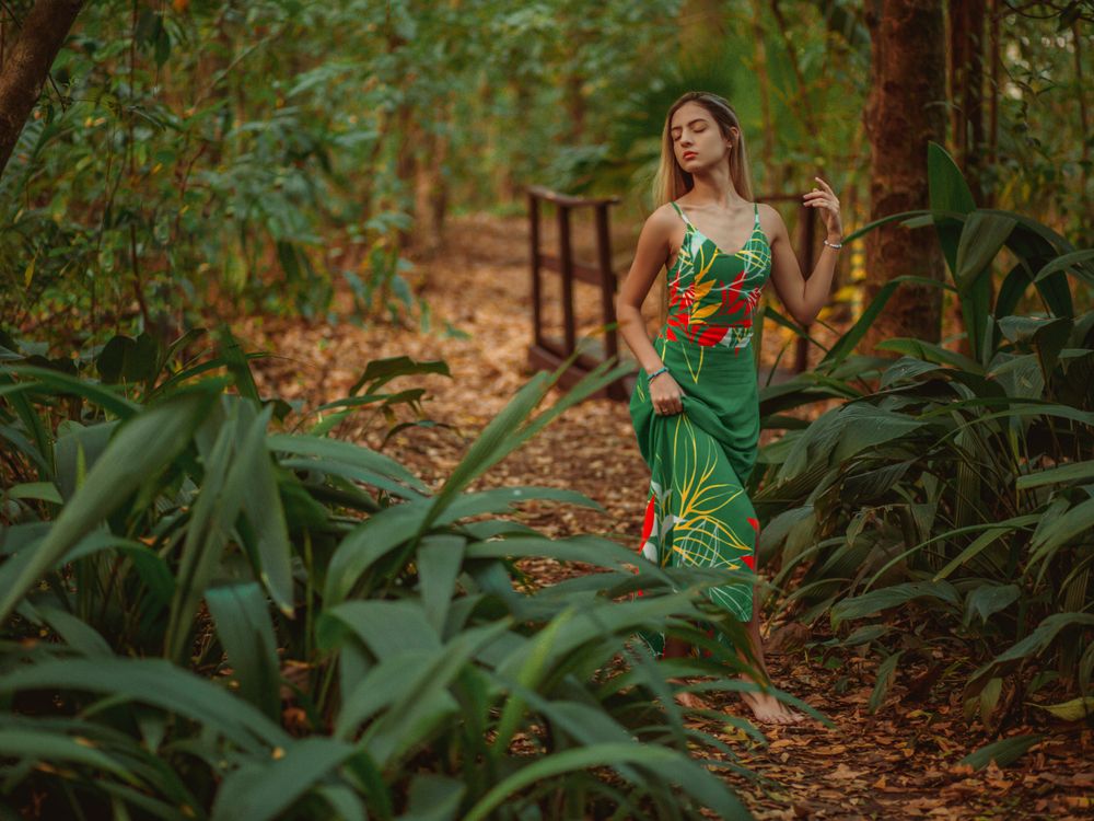 Woman Wearing Green Dress Posing in a Forest · Free Stock Photo