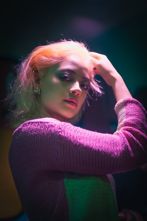 Young Woman Posing in Pink Lighting 