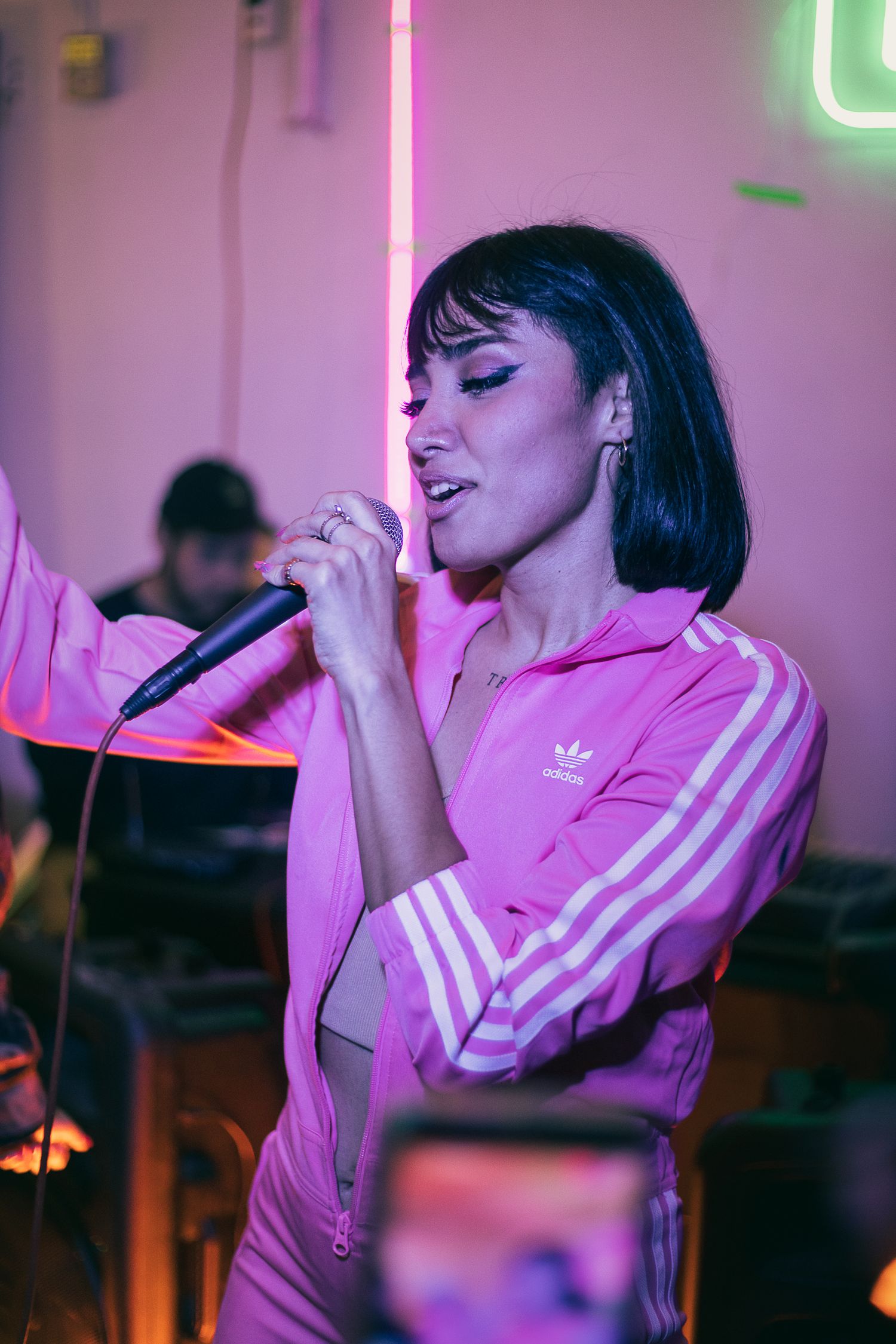 Vibrant pop stage performance with warm caramel hues