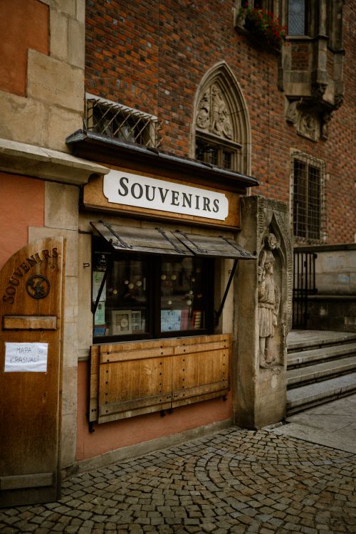 Free A quaint souvenir shop with a classic brick facade in a historic city setting. Stock Photo
