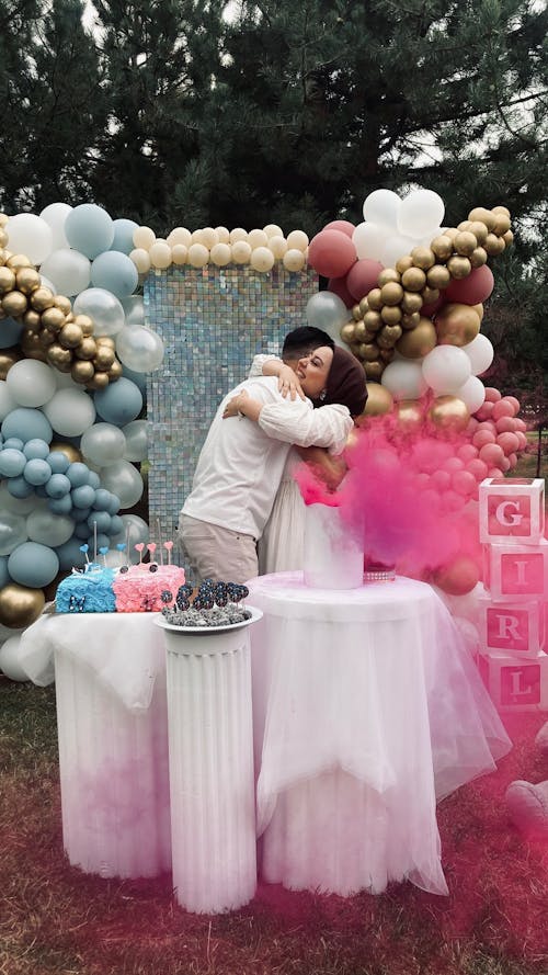 Free Couple Embracing on Birthday Party Stock Photo