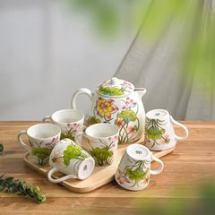 Hand-painted tea service on a wooden tray — Sứ Bát Tràng on Pexels