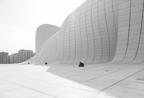 People Sitting by Walls of Heydar Aliyev Center