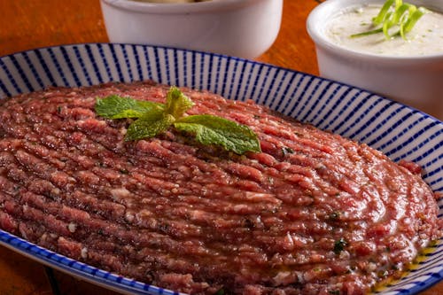A Meaty Dish on a Large Plate