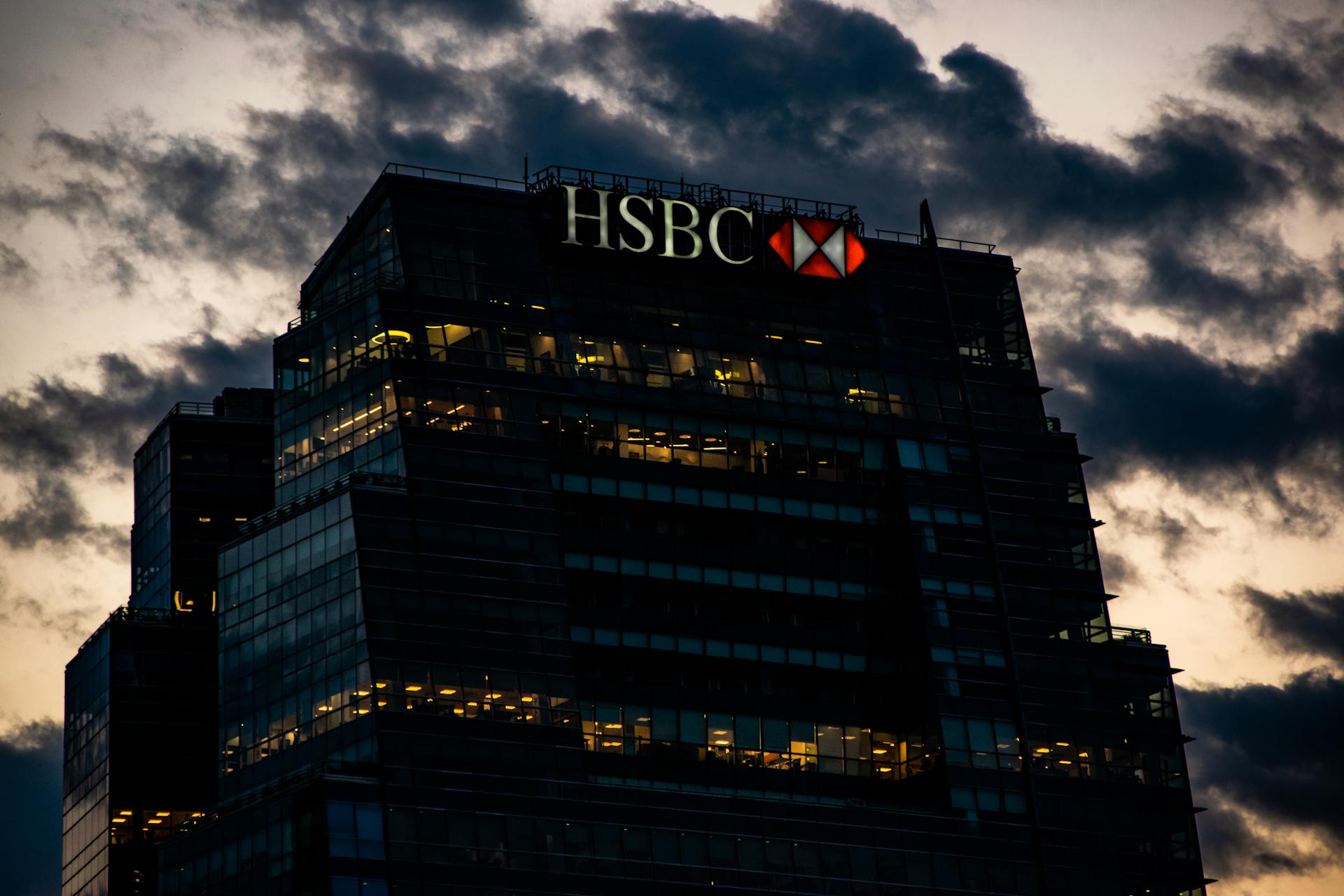 Facade of a Modern Bank Building in City at Sunset