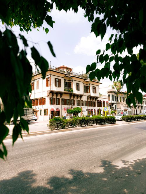 Free Discover the classic architecture of Seyhan, Adana with this vibrant streetscape view. Stock Photo