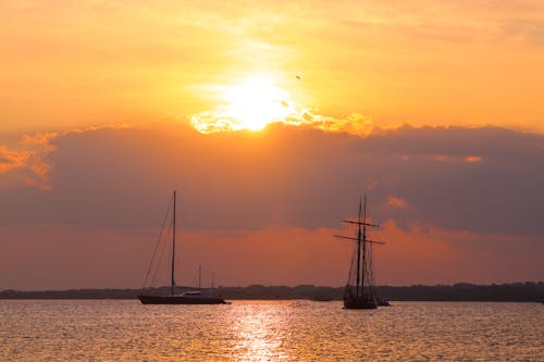 Photos gratuites de bateaux, coucher de soleil, mer