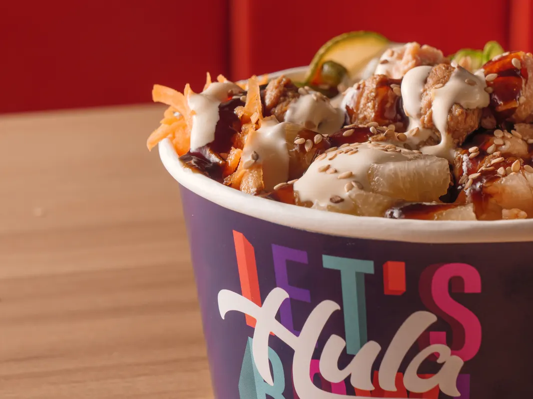 A fresh Hawaiian poke bowl served in a casual container