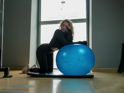 Woman Exercising with Ball