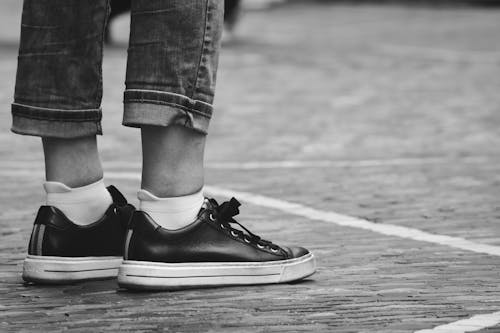 Legs and Shoes of Standing Person in Black and White