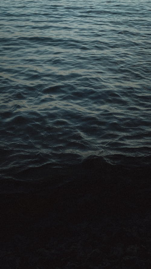 Dark Photo of a Sea with Ripples