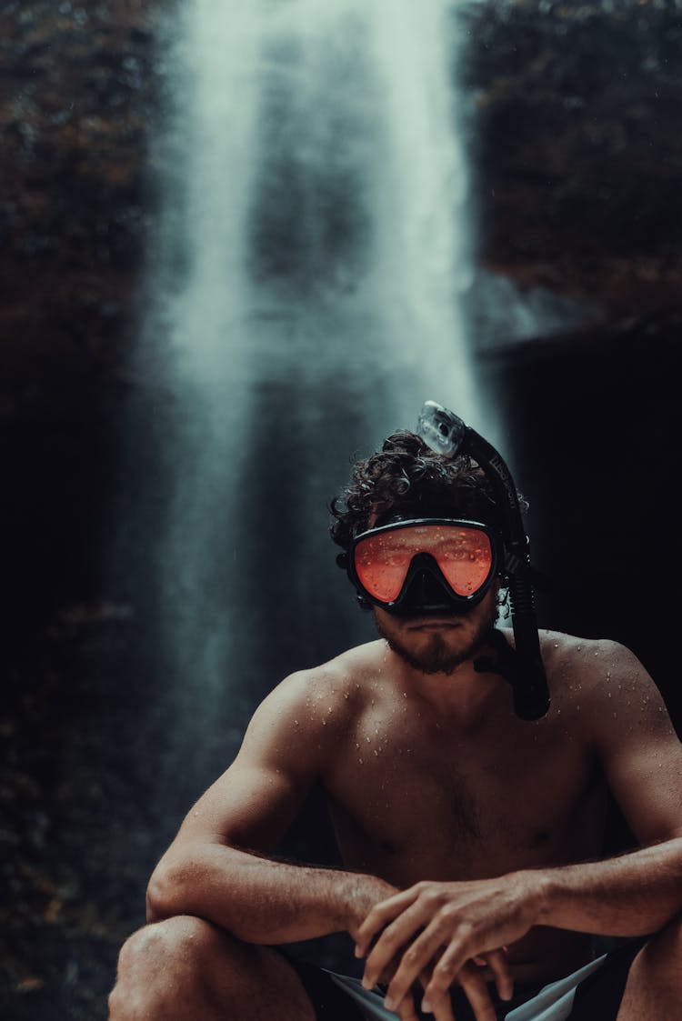 Muscular Man In Scuba Mask Against Waterfall