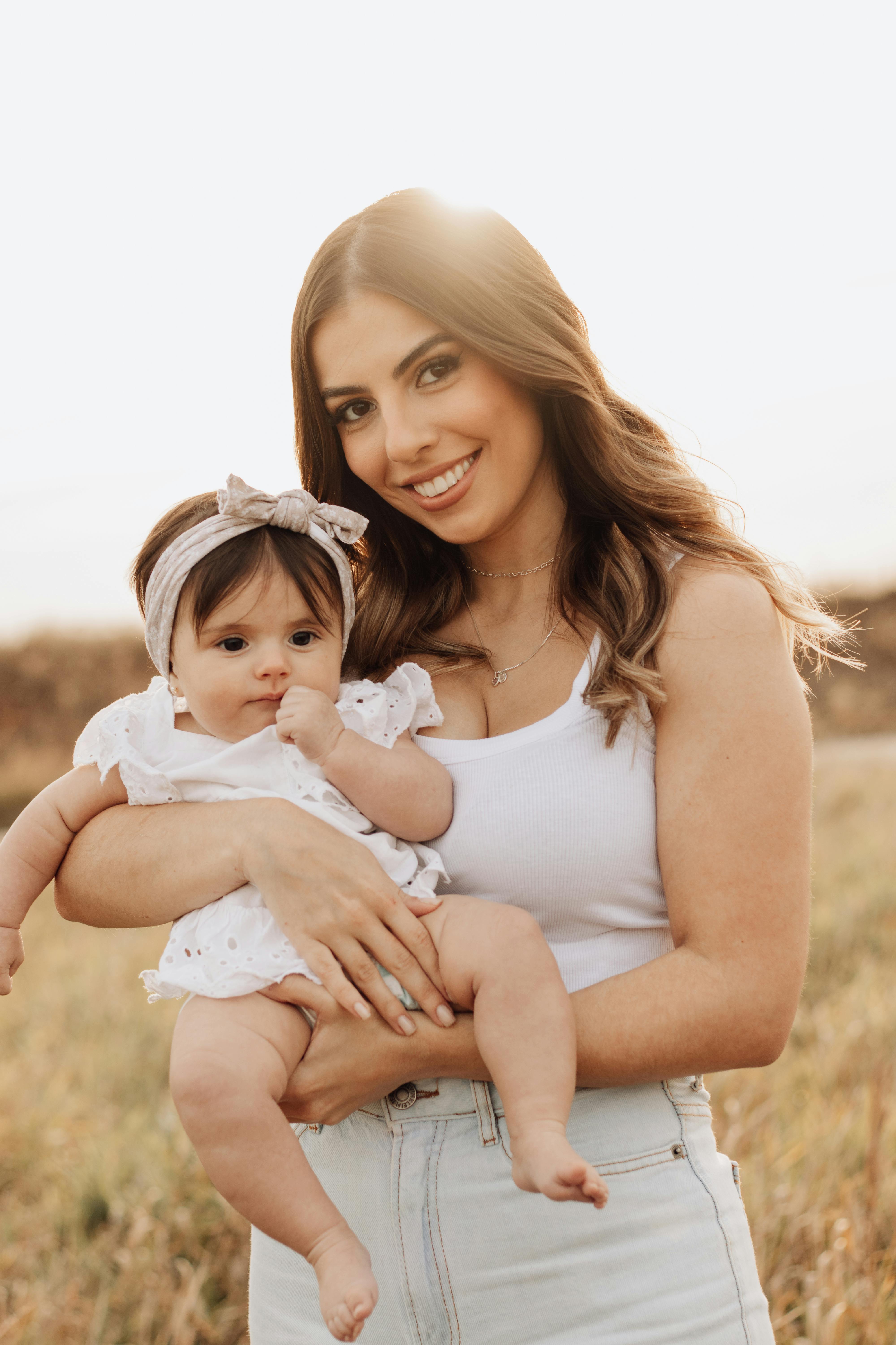 portrait of smiling mother with baby