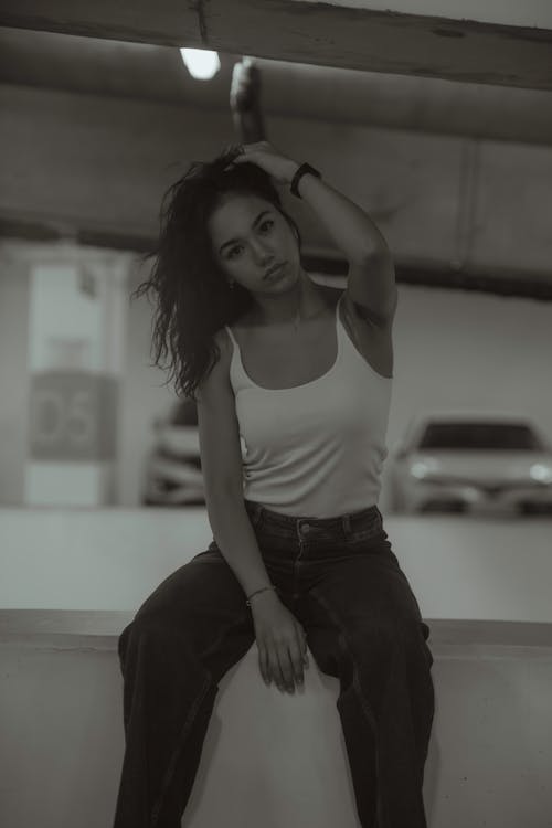 Young Woman Posing on Underground Parking Lot
