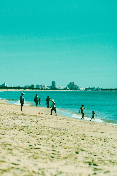 Tourists Having Fun on the Beach