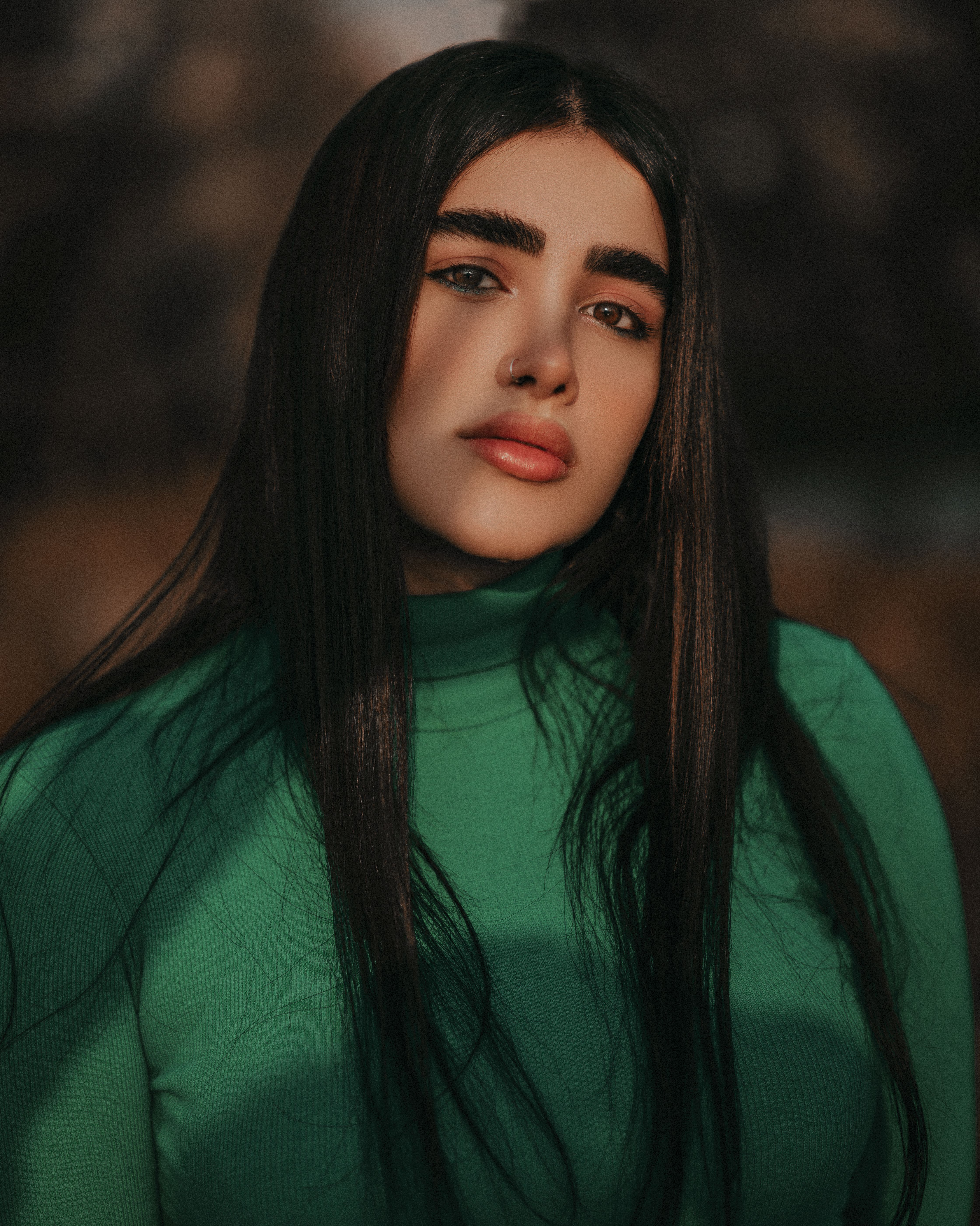 Woman in emerald green turtleneck